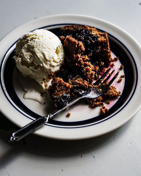 A warm dessert made with rye and wild bilberries and served with vanilla ice cream